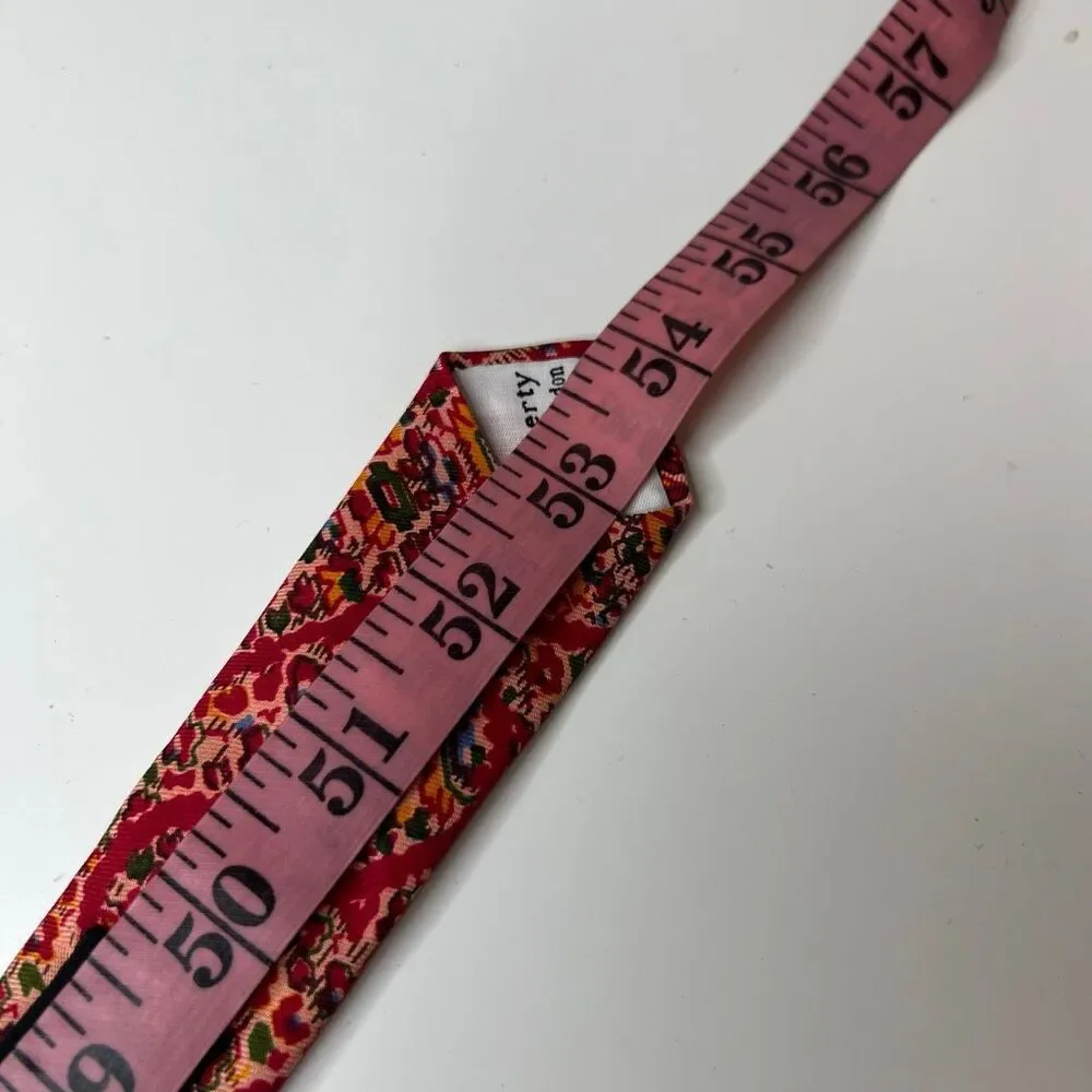 Liberty of London vintage red patterned silk necktie features a vibrant tie